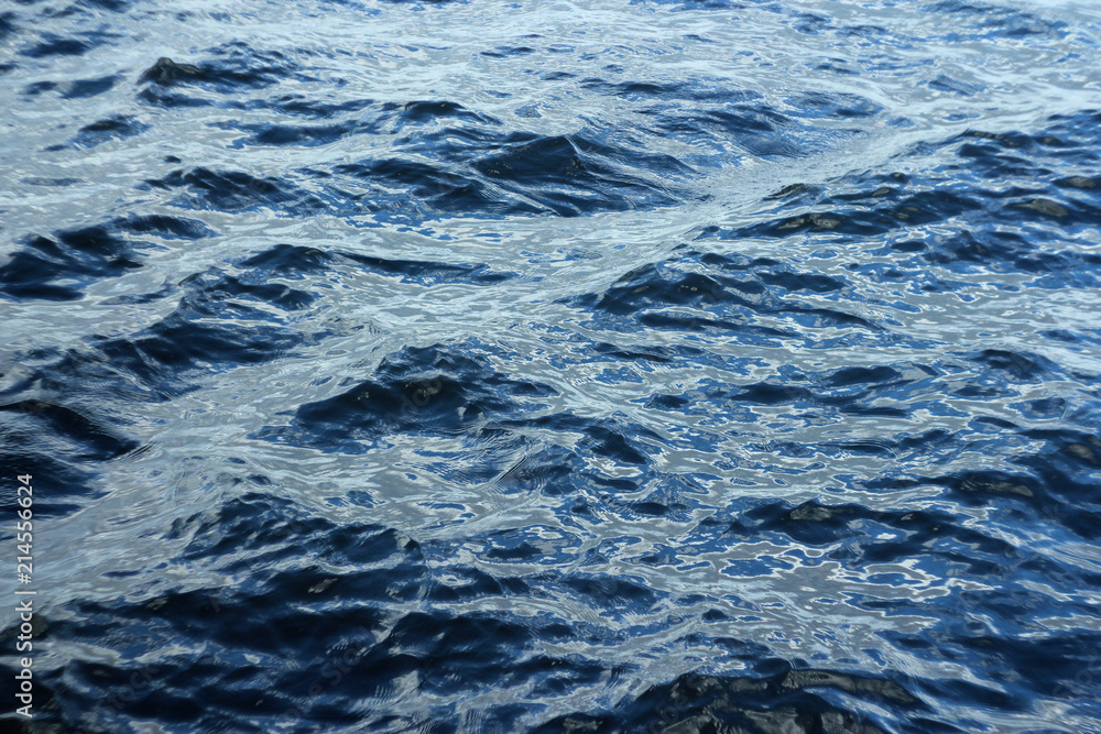 small waves on the water surface background small waves on the water surface background