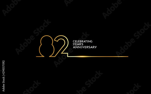 82 Years Anniversary logotype with golden colored font numbers made of one connected line, isolated on black background for company celebration event, birthday