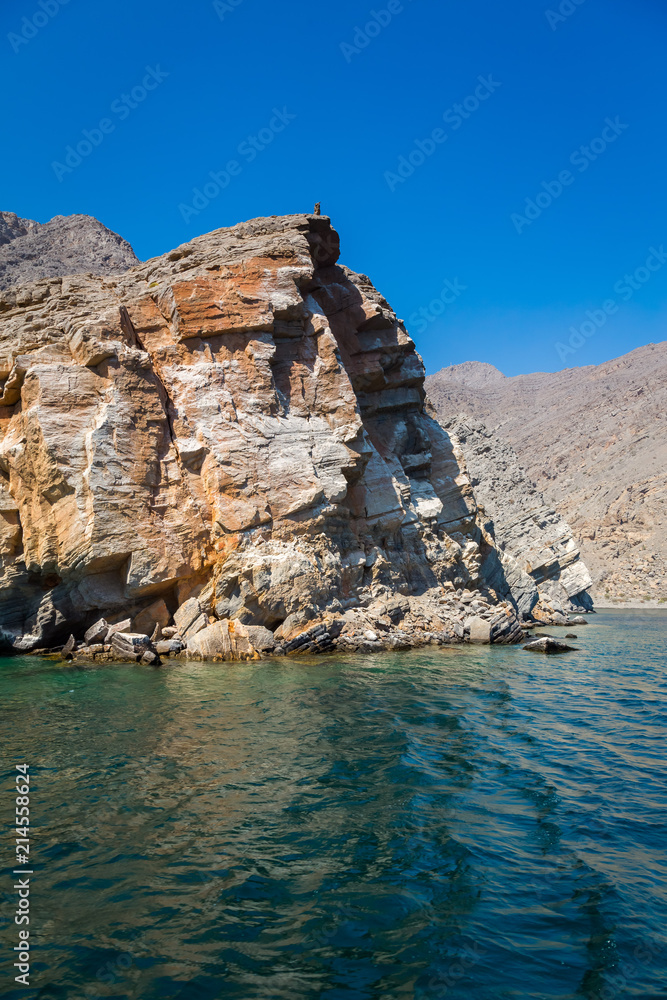 Beautiful coastal scenery near Khasab, in Musandam peninsula, Oman, photo taken from a boat during a tour.