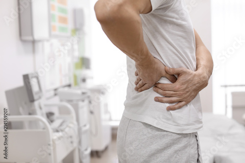 Man suffering from flank pain in orthopedist's office