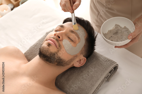 Cosmetologist applying cosm...