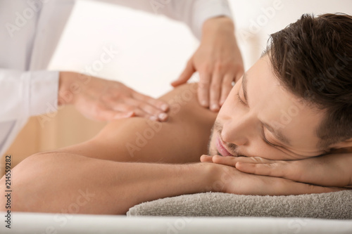Man having massage in spa salon, closeup