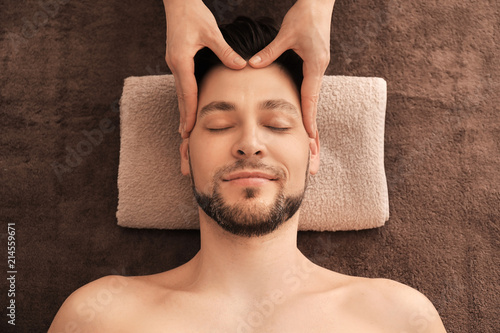 Young man receiving massage...