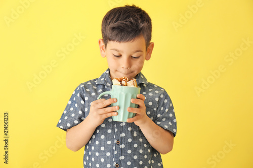 Cute little boy with cup of...