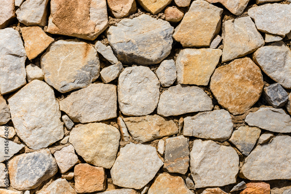 Fototapeta premium Texture of a stone wall as background