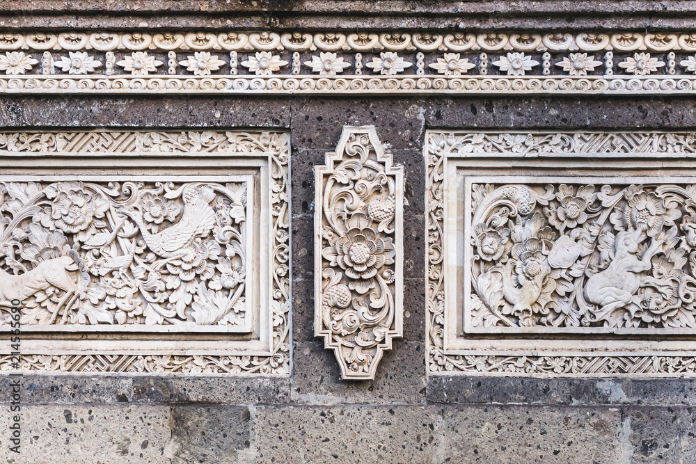 Traditional balinese stone carving, wall in temple