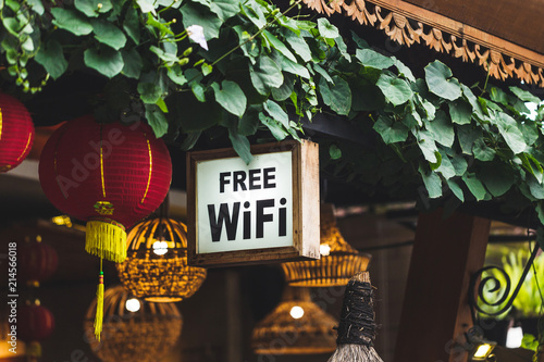 Konstfotografi Free Wi-Fi sign hanging in traditional chinese street restaurant