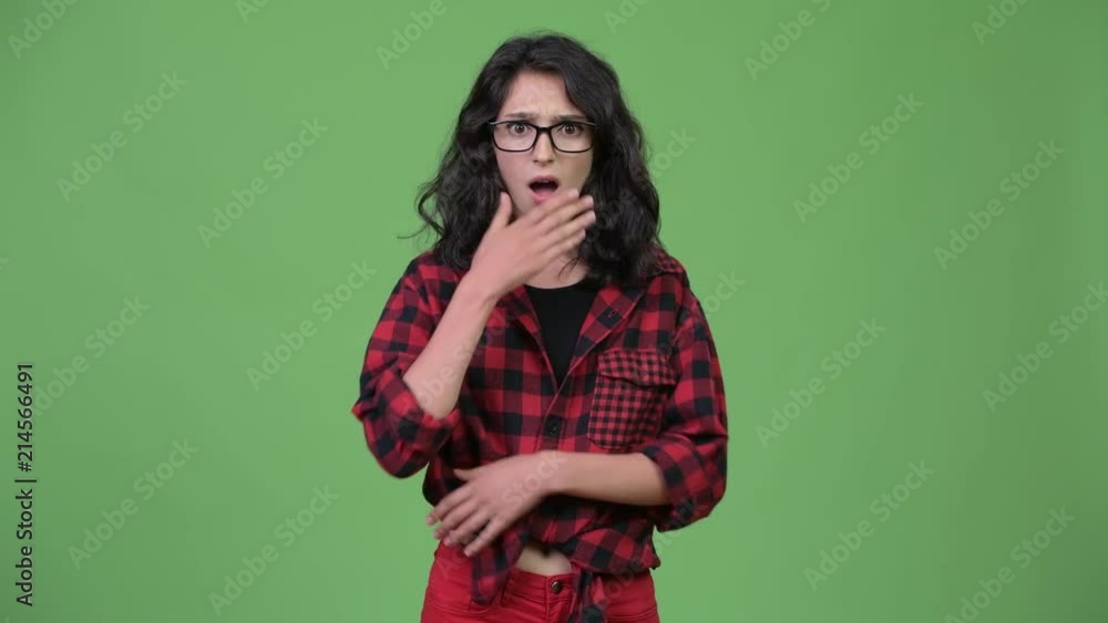 Young beautiful businesswoman looking shocked Young beautiful businesswoman looking shocked