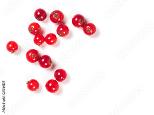 Creative layout of red currant berries. Food and diet concept. Top view of ripe red currant berries with copy space. Isolated on white with clipping path.
