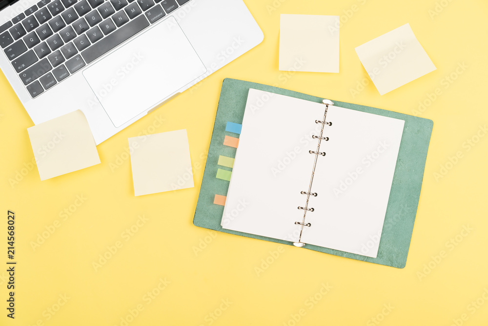notebook on yellow background notebook on yellow background