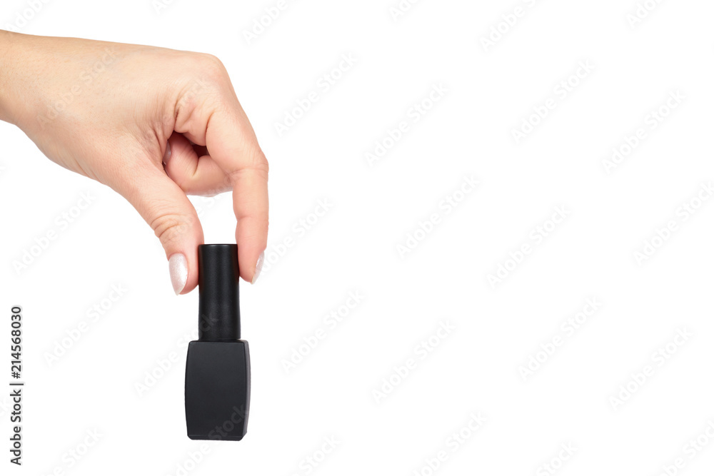 Black nail polish bottle with hand isolated on white background, copy space template Black nail polish bottle with hand isolated on white background, copy space template