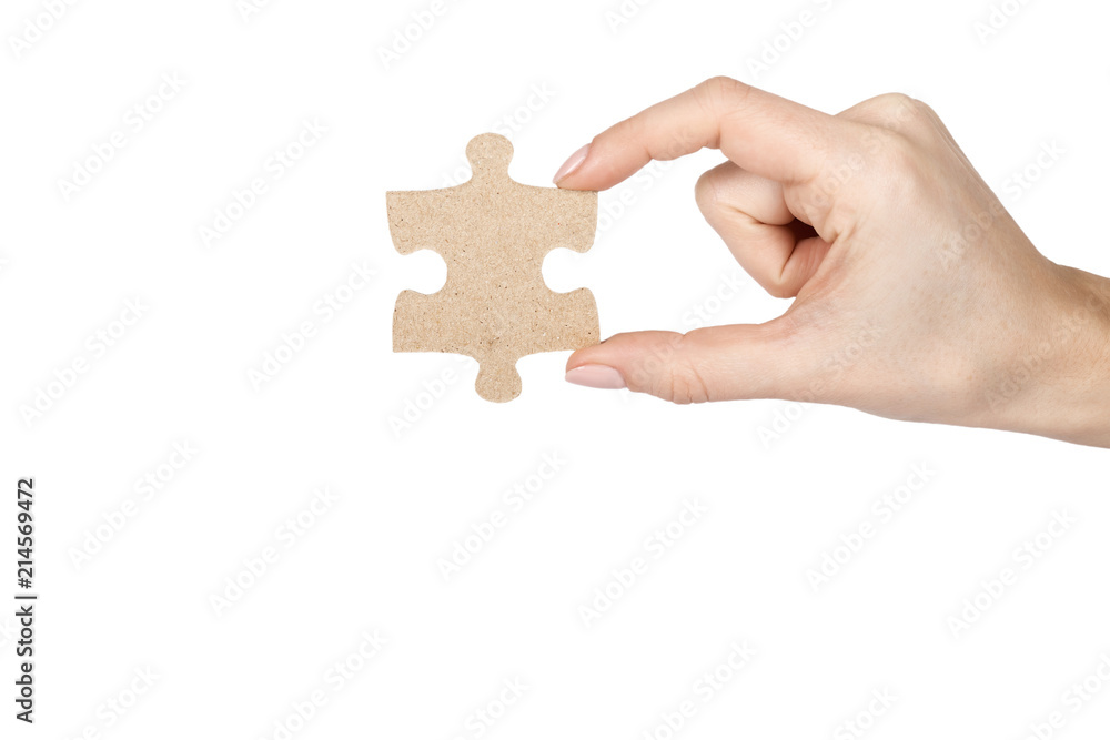 Piece of puzzle with hand, isolated on white background. copy space template Piece of puzzle with hand, isolated on white background. copy space template