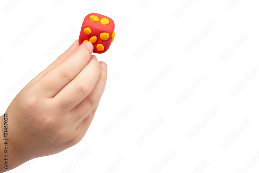 Red dice with kid hand, isoalted on white background. copy space template Red dice with kid hand, isoalted on white background. copy space template