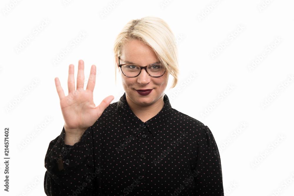Blonde female teacher wearing glasses showing number five with fingers Blonde female teacher wearing glasses showing number five with fingers
