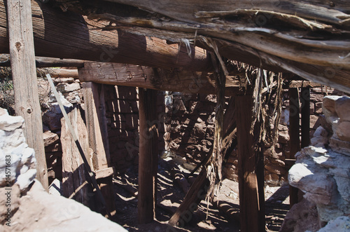 looking into the old and broken down dugout for the old butch cassidy and the wild bunch,  photo