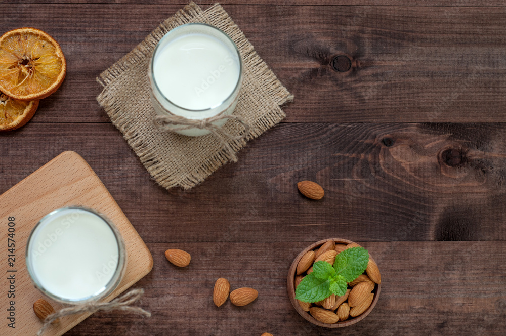 Top view almond milk with almond on the table. Top view almond milk with almond on the table.