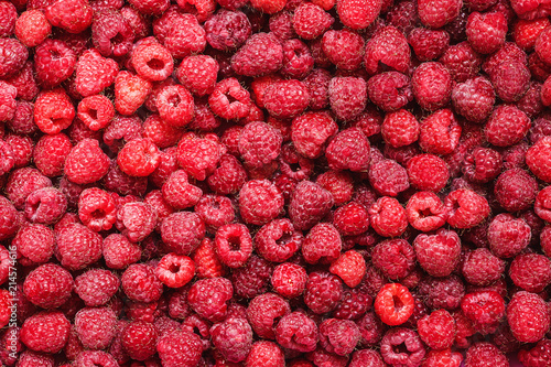 Fresh delicious sweet raspberries background closeup photo. photo