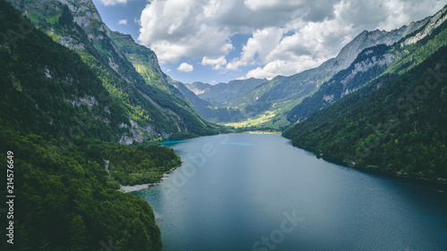 Fototapeta Naklejka Na Ścianę i Meble -  aerial view of deep blue mountain lake in swiss alps, klontalersee switzerland
