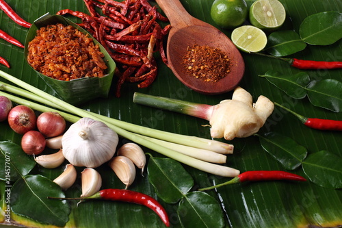 Famous Thai Food Hot and Spicy sauce with local ingredient fresh herb, paste sauce and vegetable arrange set , South East Asia style healthy food low price Top view on banana leaf