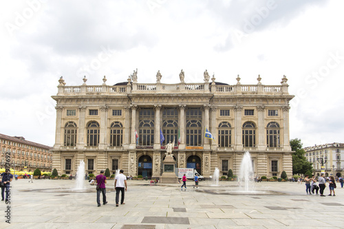 Turin, Italy- June 12, 2018: Piazza Castello, central baroque square in Turin, Italy. Tourists visiting Piazza Castello, the central baroque square