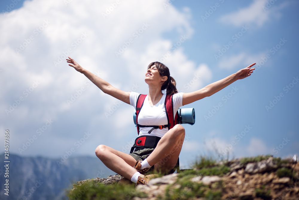 Young and beautiful female hiker with backpack enjoying outdoor Young and beautiful female hiker with backpack enjoying outdoor