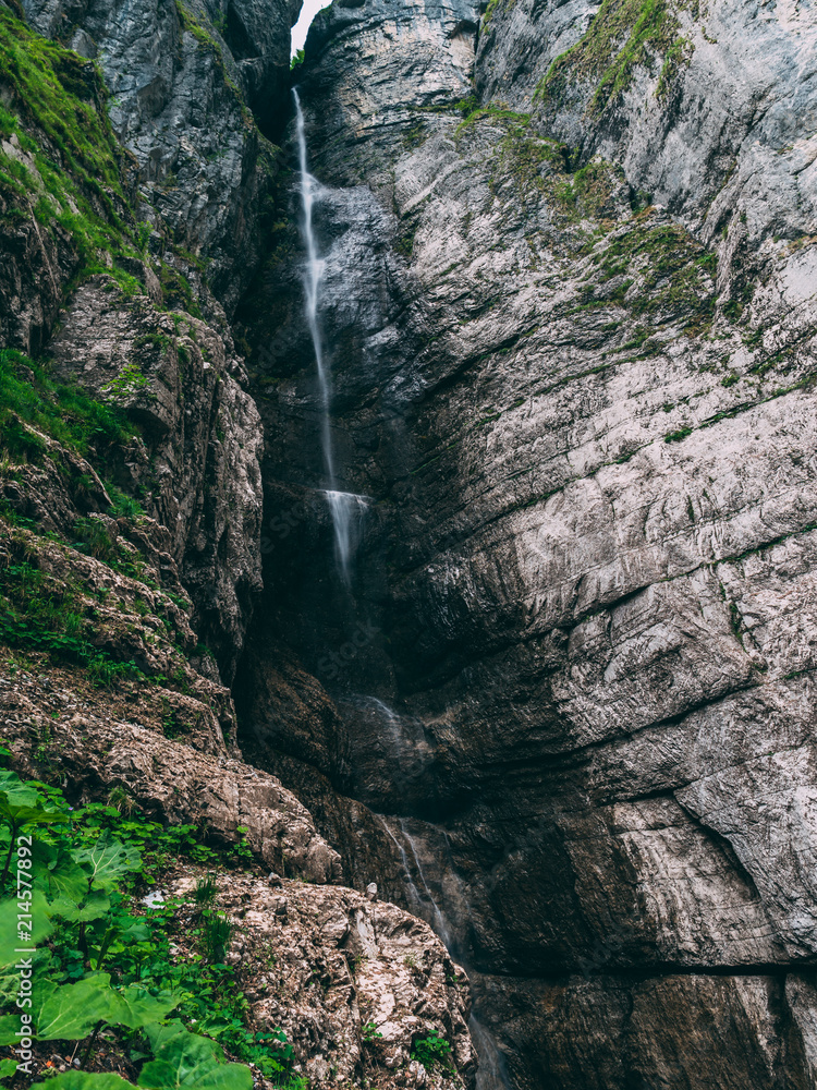almost dried out waterfall in the swiss mountain alps