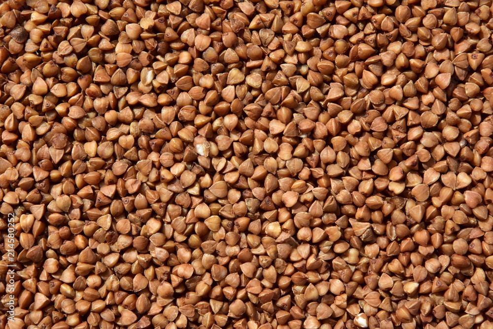 Buckwheat contrast texture. Textures from raw buckwheat grains. Healthy food. Top view. Buckwheat contrast texture. Textures from raw buckwheat grains. Healthy food. Top view.