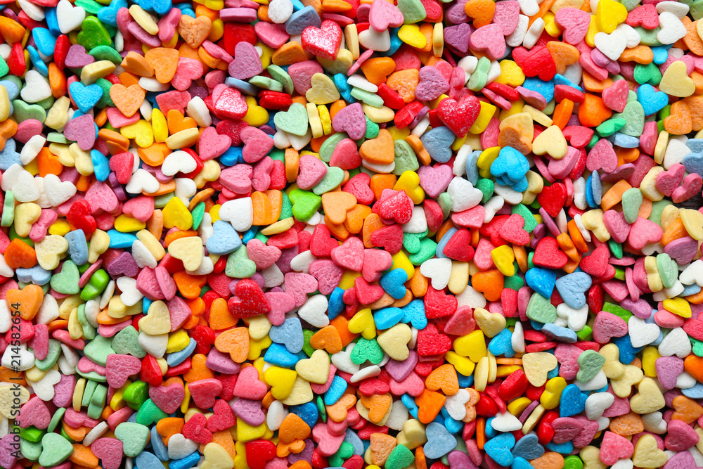 Many heart-shaped candies as background Many heart-shaped candies as background