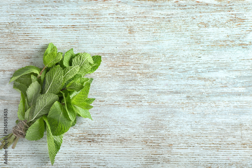 Fresh mint on wooden background Fresh mint on wooden background