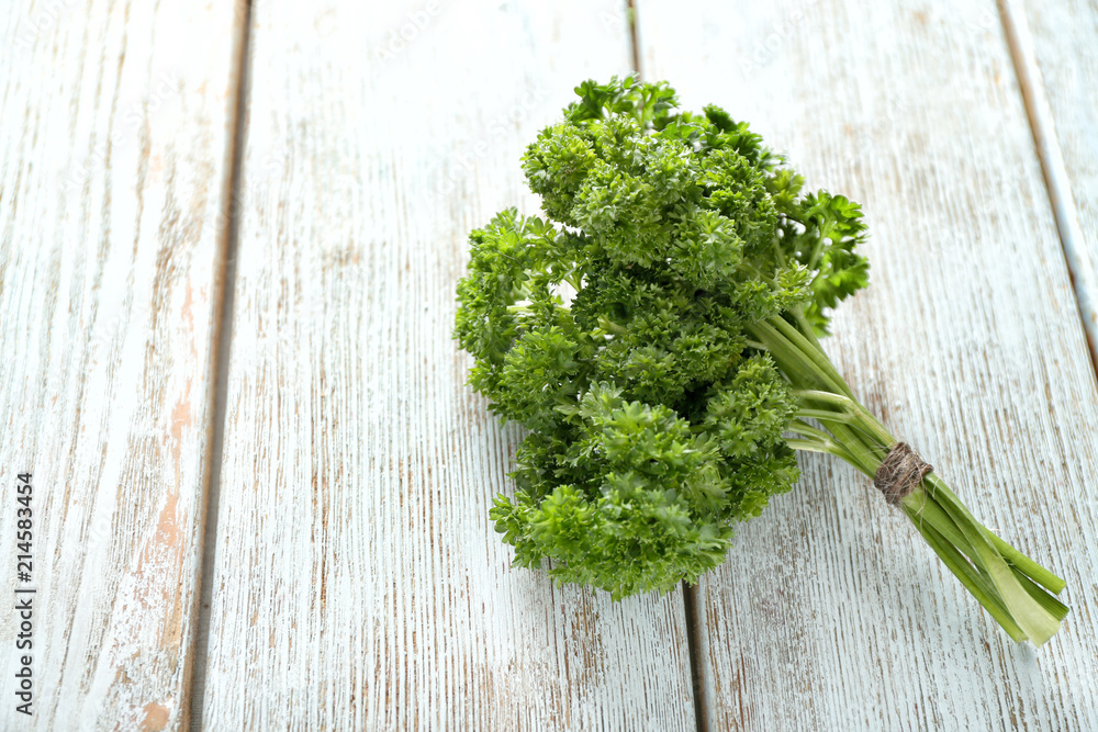 Fresh parsley on wooden background