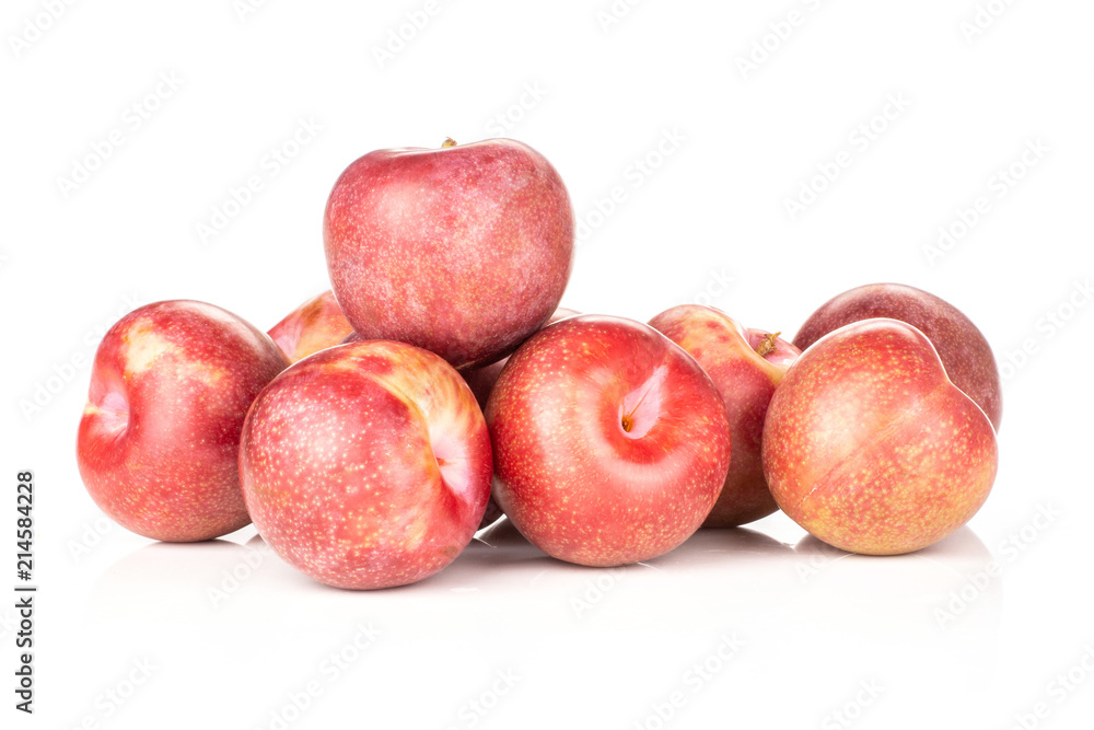 Obraz premium Lot of whole fresh pluot interspecific plums variety stack isolated on white