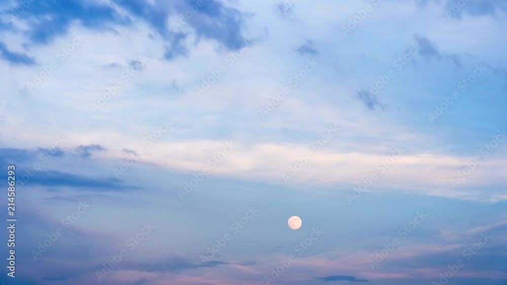 Scenic view of late evening sky with full moon and purple clouds. Scenic view of late evening sky with full moon and purple clouds.