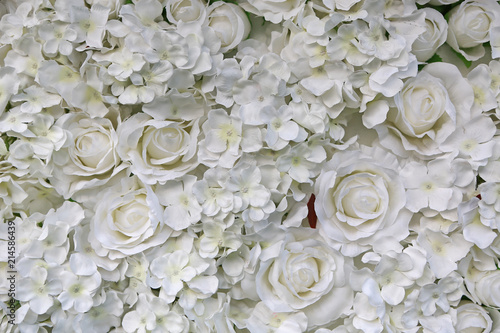 Fototapeta Naklejka Na Ścianę i Meble -  Artificial white rose and flowers background.
