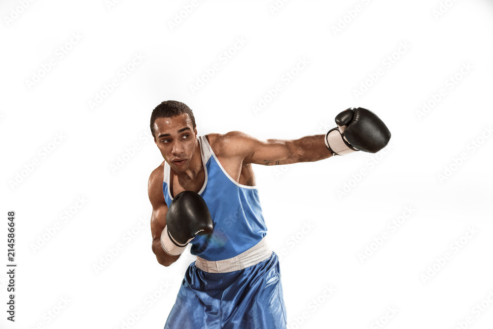 Sporty man during boxing exercise. Photo of boxer on white background
