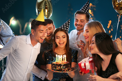 Young woman with friends an...