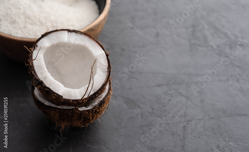 Beautiful composition with coconuts on black background. Copy space.