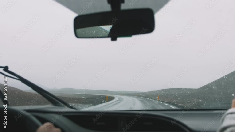 Cinematic POV shot of car window covered with snow in motion, Iceland Cinematic POV shot of car window covered with snow in motion, Iceland