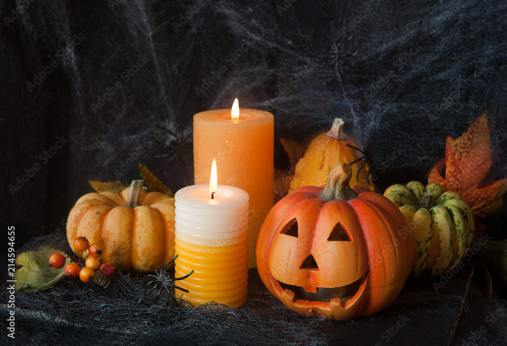 Halloween pumpkin decor with candle and spiders Halloween pumpkin decor with candle and spiders