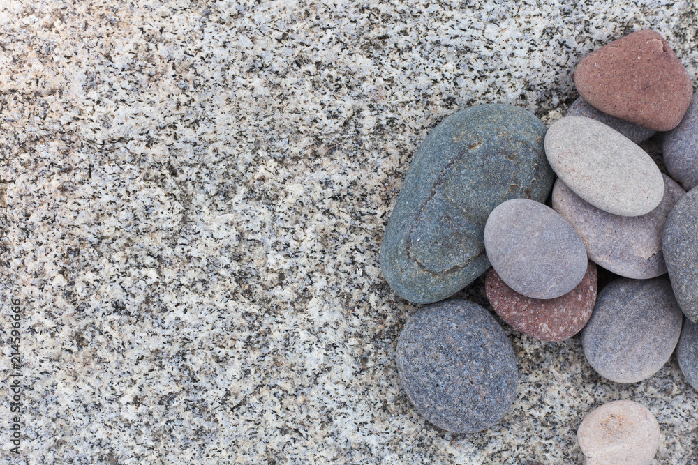Stones on natural light granite background Stones on natural light granite background