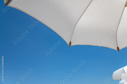 Parasol with blue sky background