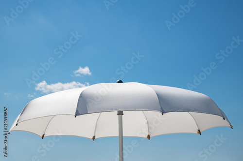 Parasol with blue sky background