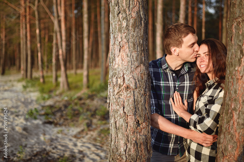 young man kisses the girl in park © Ryzhkov Oleksandr