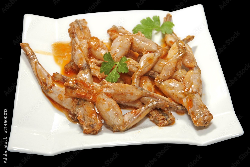 Deliciosa ración de ancas de rana en salsa, típica de la cocina española Deliciosa ración de ancas de rana en salsa, típica de la cocina española