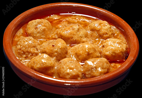 Deliciosa ración de albóndigas en salsa, tipica de la cocina española photo