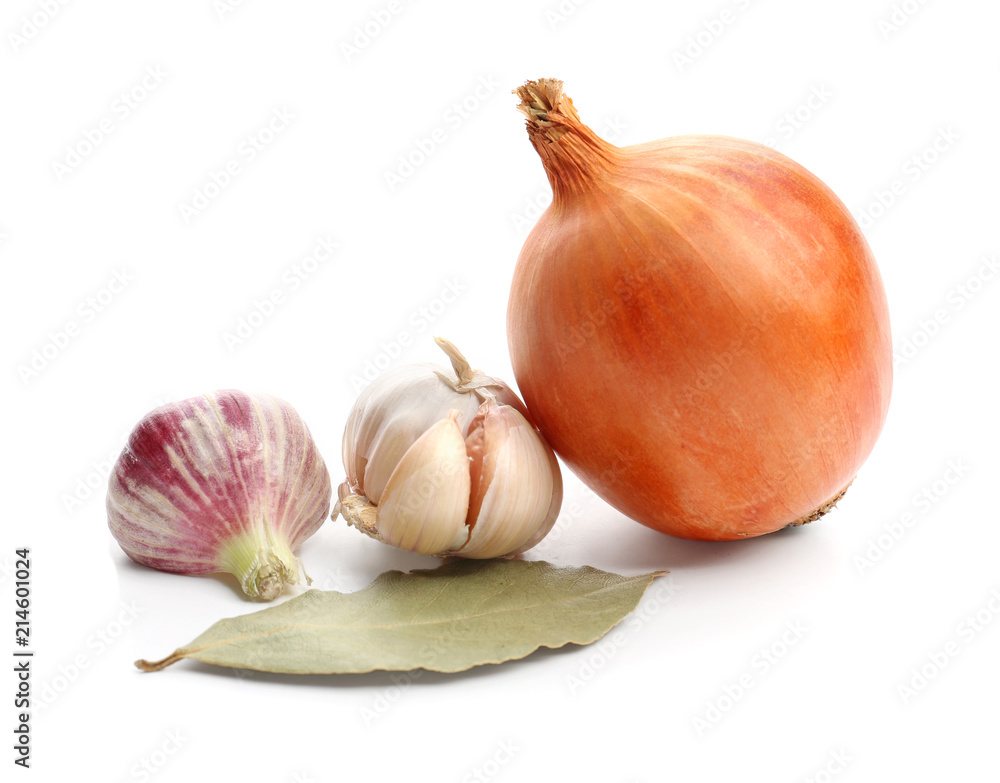 Fototapeta premium Onion and garlic with bay leaf on white background