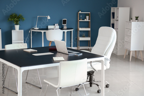 Stylish workplace with laptop on table in office © Pixel-Shot