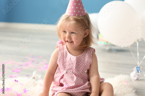Cute little girl in birthda...
