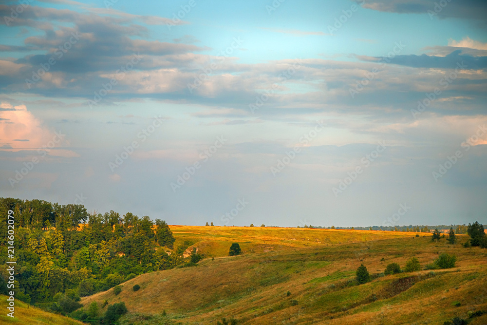 Panorama of a beautiful countryside summer landscape at sunset Panorama of a beautiful countryside summer landscape at sunset