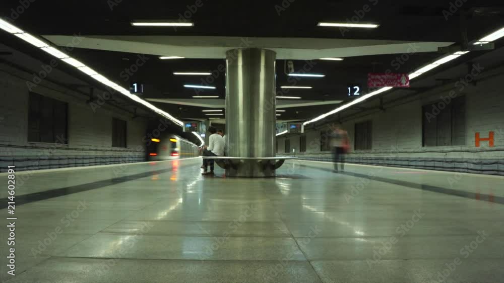 Timelapse of two track subway in India, not crowded, with yellow and red lights on trains creating intermittent streaks Timelapse of two track subway in India, not crowded, with yellow and red lights on trains creating intermittent streaks
