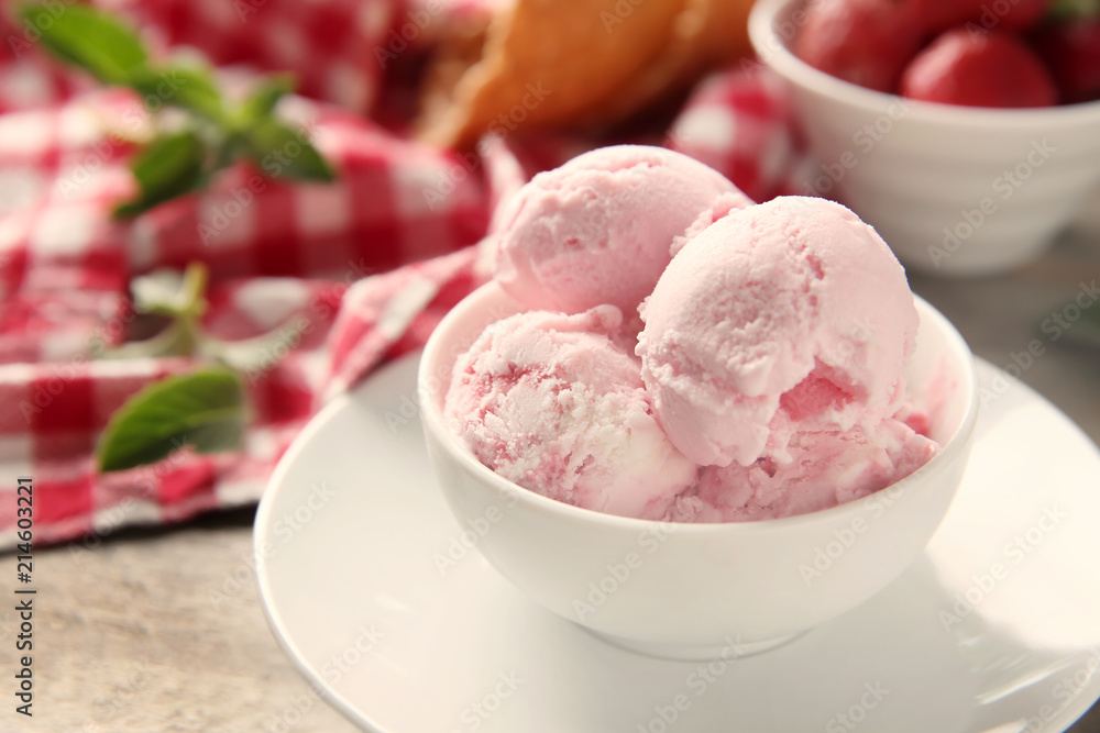 Bowl with tasty strawberry ice cream on wooden table Bowl with tasty strawberry ice cream on wooden table